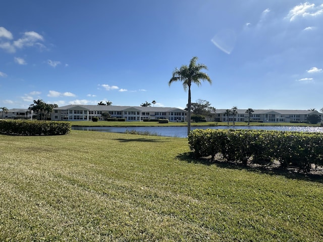 exterior space with a lawn and a water view