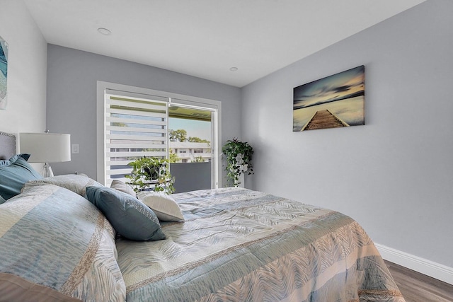 bedroom with hardwood / wood-style flooring