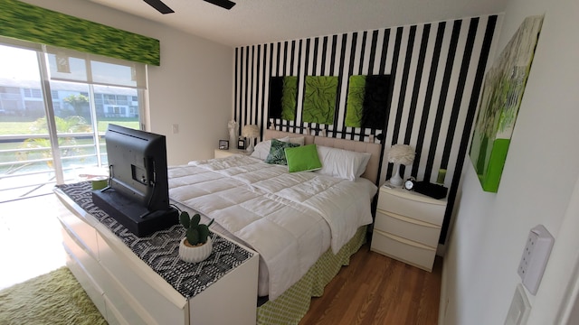 bedroom with ceiling fan and hardwood / wood-style floors