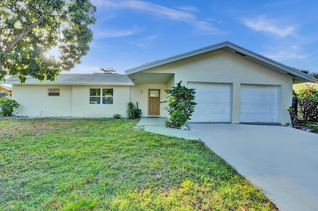 ranch-style home featuring a garage and a front lawn