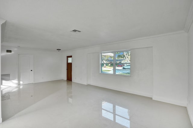 unfurnished room with crown molding