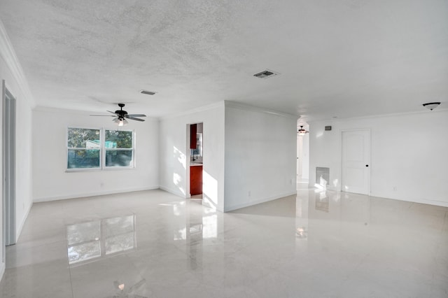 unfurnished room with ceiling fan and crown molding