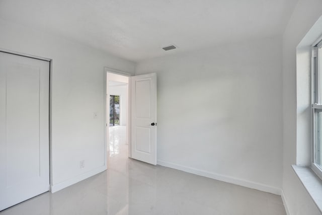 unfurnished bedroom featuring a closet