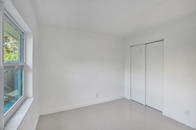 unfurnished bedroom with a closet