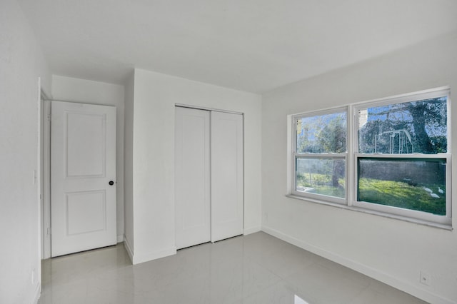 unfurnished bedroom featuring a closet