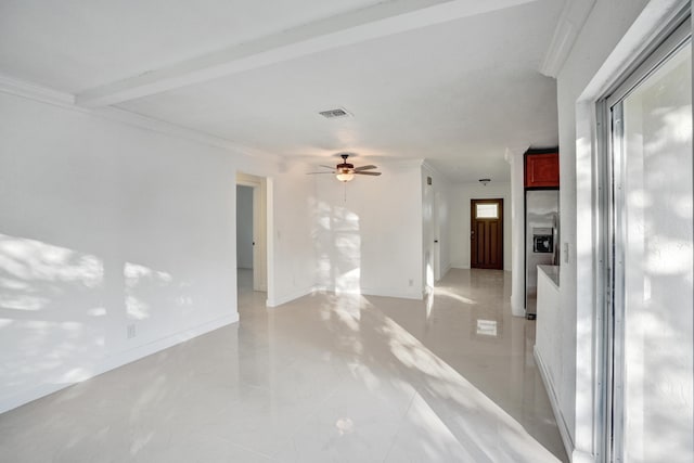 spare room featuring ceiling fan and ornamental molding