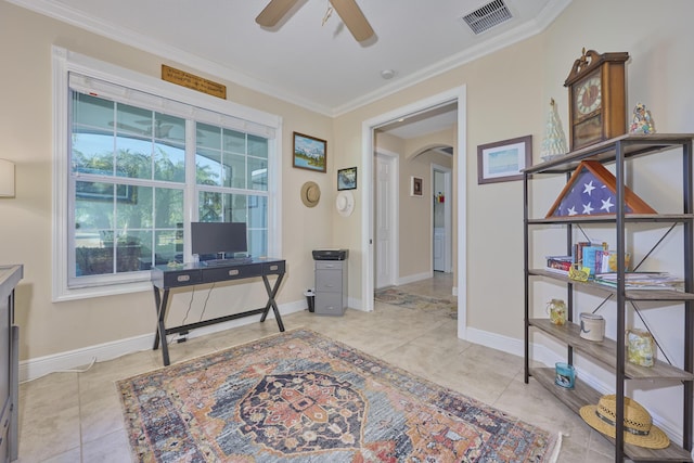 home office with arched walkways, light tile patterned floors, visible vents, a ceiling fan, and ornamental molding