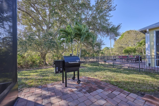 view of patio with fence and grilling area