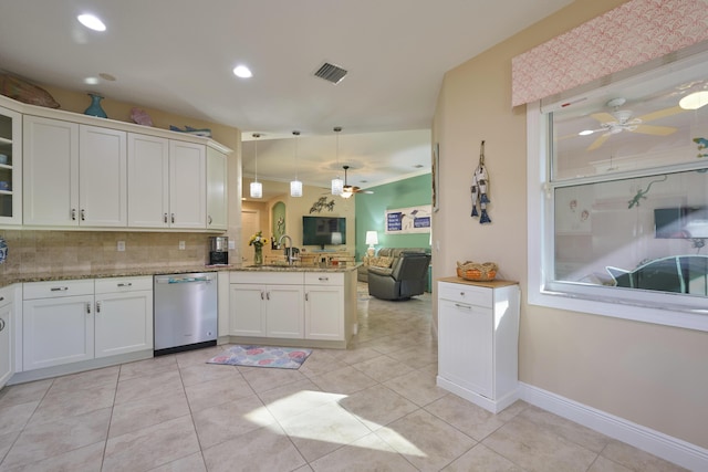 kitchen with a peninsula, visible vents, a ceiling fan, open floor plan, and stainless steel dishwasher