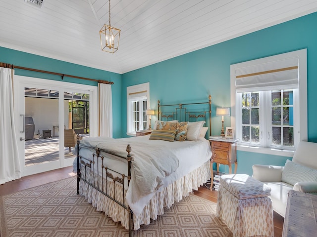 bedroom with access to exterior, a notable chandelier, lofted ceiling, and wood ceiling