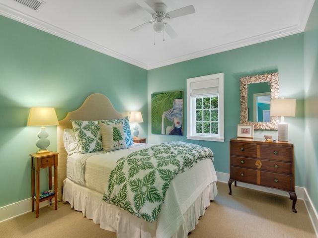 carpeted bedroom featuring ceiling fan and ornamental molding