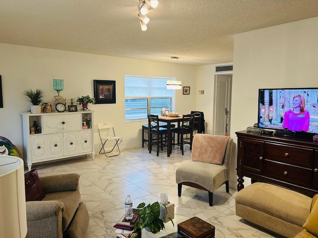 living room with a textured ceiling