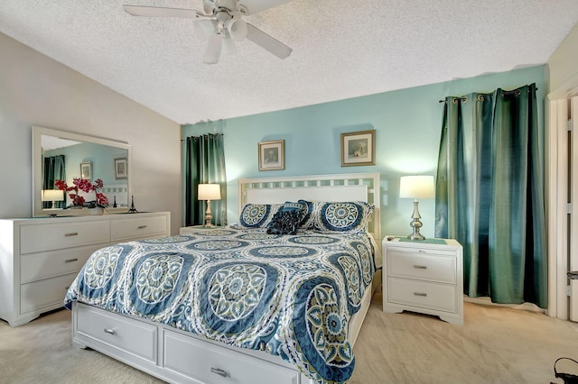 carpeted bedroom featuring a textured ceiling, ceiling fan, and vaulted ceiling