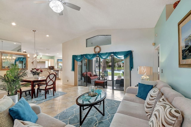 tiled living room featuring lofted ceiling and ceiling fan with notable chandelier