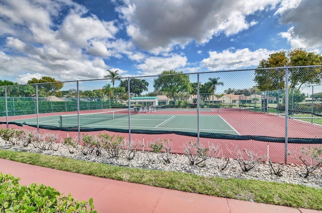 view of tennis court with fence
