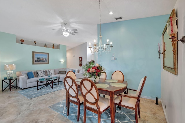 tiled dining space featuring ceiling fan with notable chandelier