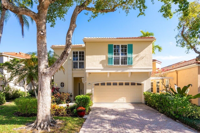 mediterranean / spanish house with a garage