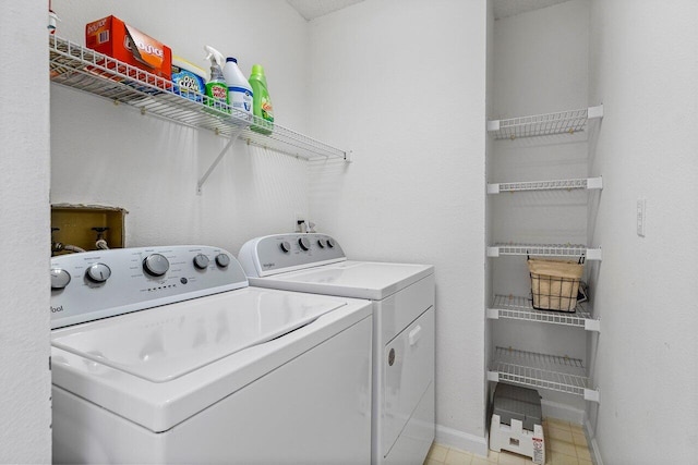 washroom featuring washing machine and clothes dryer