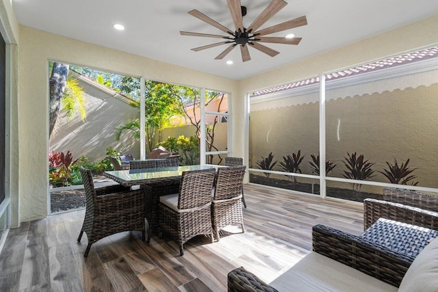 sunroom featuring ceiling fan