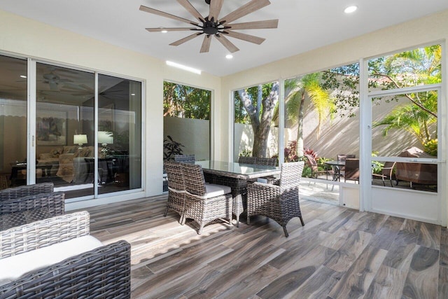 sunroom / solarium with ceiling fan