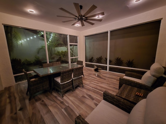 sunroom featuring ceiling fan