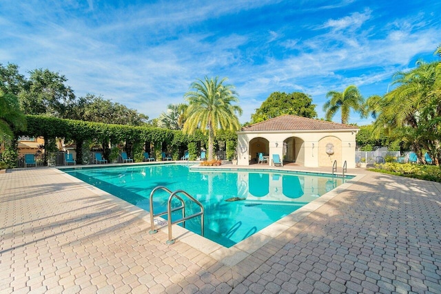 view of swimming pool with a patio