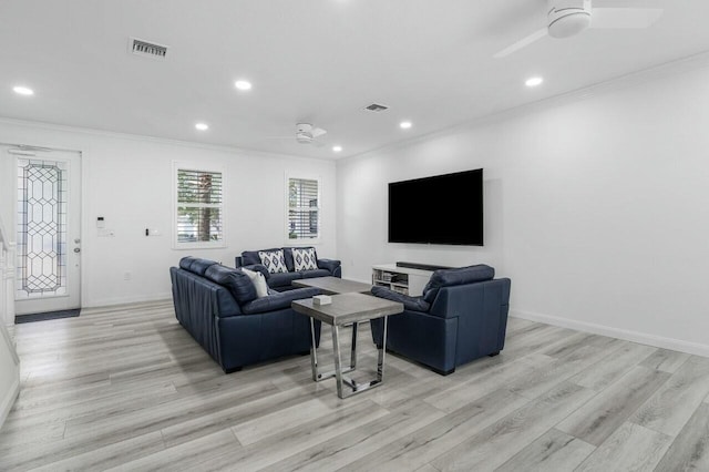 living room with ceiling fan, light hardwood / wood-style floors, and ornamental molding