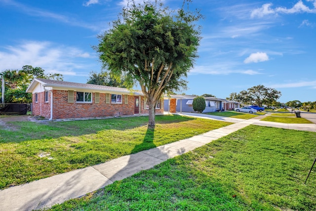 single story home featuring a front lawn