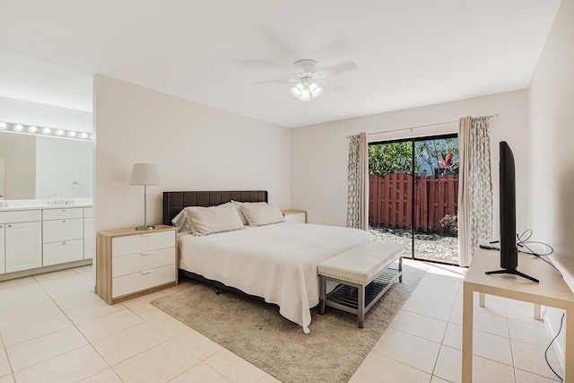 bedroom featuring light tile patterned floors, access to outside, ceiling fan, and ensuite bathroom