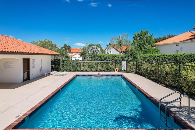 view of swimming pool featuring a patio area