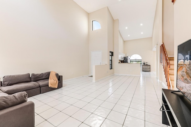 tiled living room with a towering ceiling