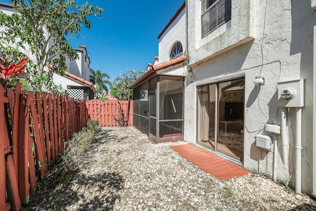 view of yard featuring a sunroom