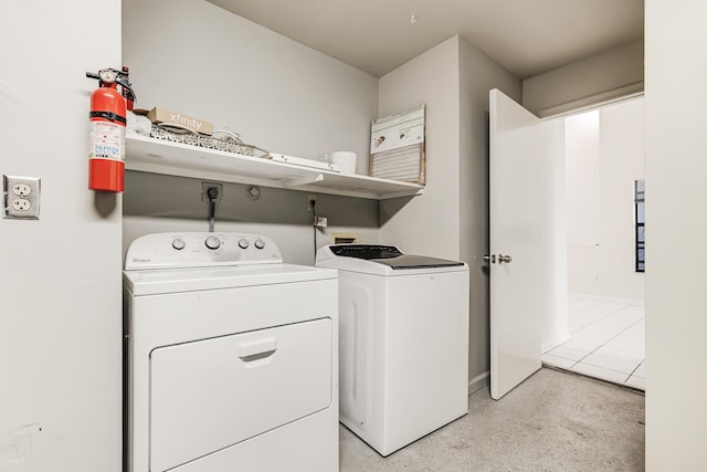 clothes washing area featuring washing machine and dryer