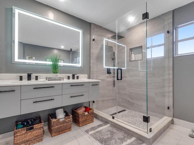 bathroom featuring vanity and an enclosed shower