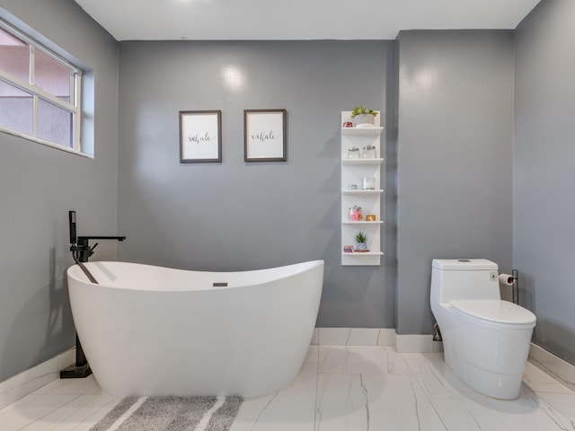 bathroom featuring a bathing tub and toilet