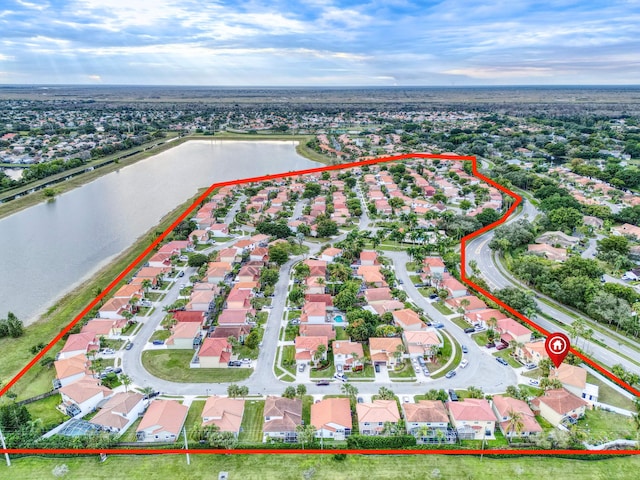 birds eye view of property featuring a water view