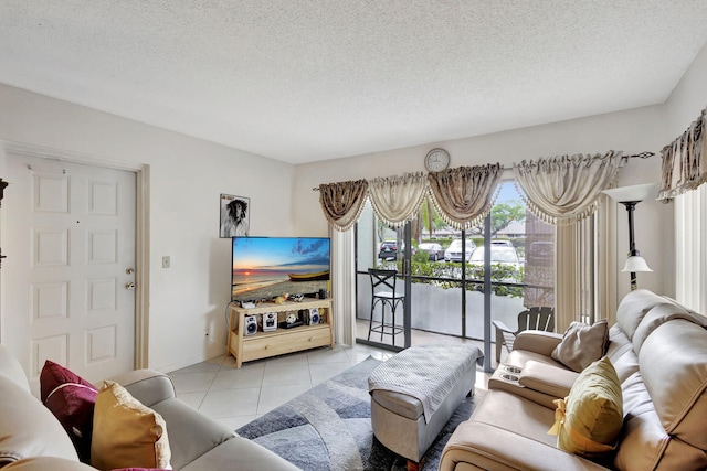 living room featuring light tile patterned flooring and a textured ceiling