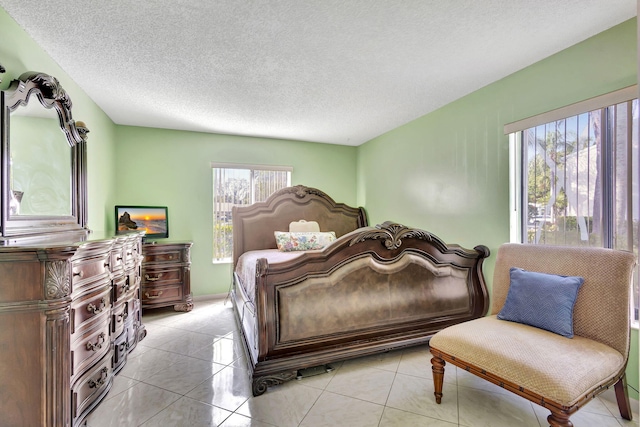 tiled bedroom with a textured ceiling