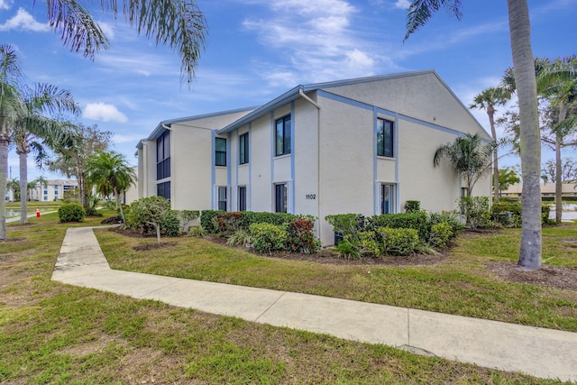 view of property exterior featuring a yard