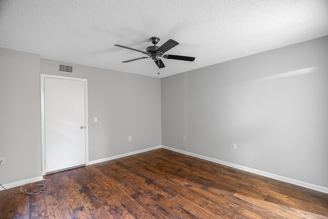 unfurnished room featuring visible vents, baseboards, ceiling fan, and hardwood / wood-style flooring