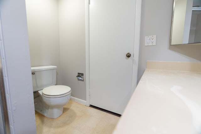 bathroom featuring toilet and vanity