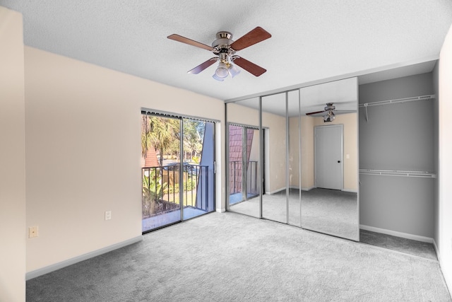 unfurnished bedroom featuring carpet flooring, ceiling fan, a textured ceiling, access to outside, and a closet