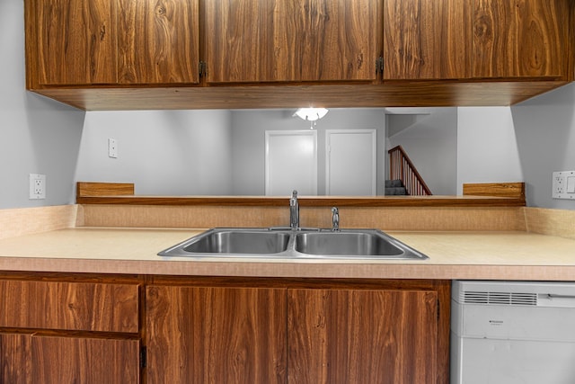 kitchen with white dishwasher and sink