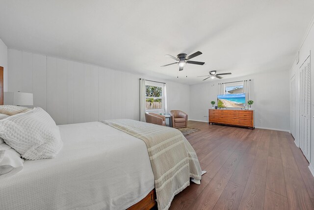 home office with ceiling fan, dark hardwood / wood-style floors, and a textured ceiling