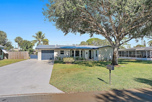 ranch-style house featuring a garage and a front yard