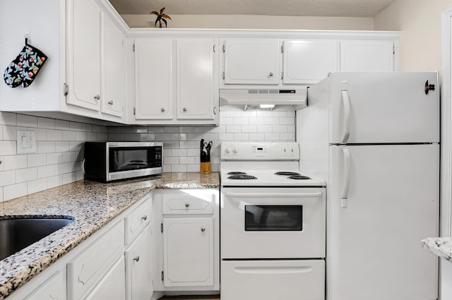 kitchen featuring white cabinets, decorative backsplash, white appliances, and range hood