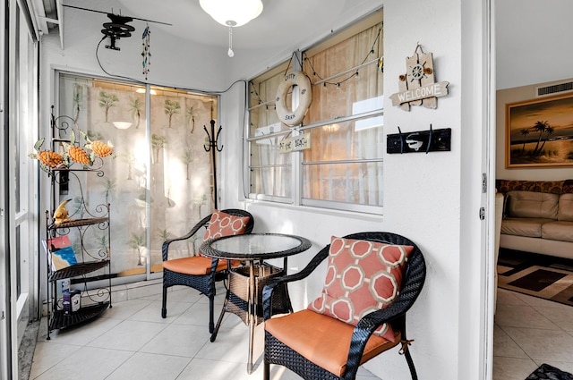 living area featuring light tile patterned flooring