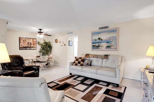 living room with ceiling fan and light tile patterned floors