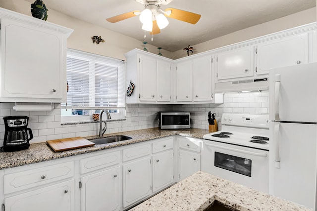 kitchen featuring backsplash, custom range hood, white appliances, sink, and white cabinets