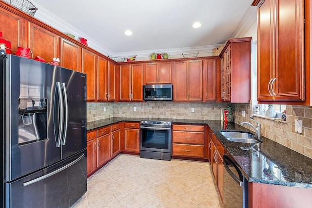 kitchen featuring ornamental molding, sink, appliances with stainless steel finishes, and dark stone counters